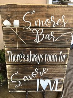 a wooden sign that says s'mores bar there's always room for someone i love