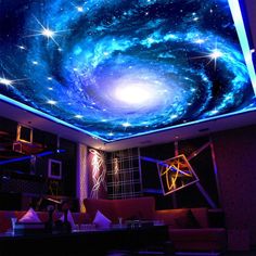 a living room filled with lots of furniture under a painting on the ceiling that looks like a spiral galaxy