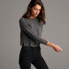 The Reagan is oversized, slouchy and easy with a loose feminine crew neck that shows off some clavicle. Slightly short cropped to the mid-waist, it’s the perfect length for untucked but long enough for a loose tuck into our Jolene denim. The combination of our Heritage Wash and the plush, hardy hand-feel makes the Reagan seem like a lived-in, long-loved tee ready to go the distance. 100% Cotton Sueded Jersey for a soft and luxurious lived-in hand feel Heritage Wash. Garment dyed for highs and lo Effortless Crew Neck Tops For Fall, Casual Long Sleeve Cropped T-shirt For Spring, Chic Cotton Cropped Sweater With Crew Neck, Fall Relaxed Fit Crew Neck Cropped T-shirt, Effortless Tops With Shirttail Hem For Fall, Effortless Fall Tops With Shirttail Hem, Trendy Boxy Fit Tops For Layering, Casual Fall Tops With Cropped Hem, Boxy Fit Tops For Fall