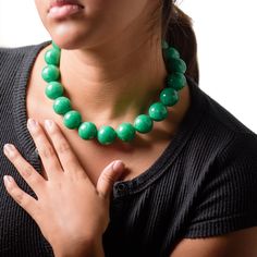 We unearthed these incredibly colored marbled green vintage beads. Bright emerald green necklace featuring vintage lucite beads in a marbled shiny finish. This chunky size is a rare find in vintage moonglow beads. The beads are from the 1960's and are super light weight. Each necklace measures about 16" + a 6" extender. Finished with gun metal colored findings. The model is showing off another colored Marco to show how you can layer Marco Necklaces for a fun look! Jewelry is designed & hand fini Green Round Jewelry With Large Beads, Green Jade Beaded Necklace With Large Beads, Green Jewelry With Large Round Beads, Jade Necklaces With Large Round Beads, Artisan Green Necklace With Large Beads, Green Glass Beaded Necklace With Large Beads, Green Emerald Necklace With Polished Jade Beads, Green Large Beads Costume Jewelry Necklace, Green Jade Emerald Necklace With Polished Beads