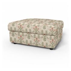 an upholstered footstool with flowers and leaves on the front, in beige