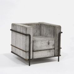 a concrete chair with metal frame and footrests on an isolated white background,