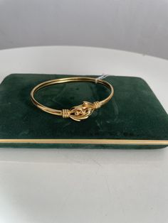 "A charming 80s gold plated 18k bangle bracelet . ....M E A S U R E S 8 .5\" in circumference. Fits most adults. Condition: excellent ( New old stock ) Shipping Is Avaliable Worldwide. Every item is carefully shipped Priority via Air Mail - shipping takes from 7 to 14 working days, depending on your location. Shipping includes Tracking. Come and check out our shop to see all items! https://www.etsy.com/shop/Themagicstories2?ref=seller-platform-mcnav Thanks!" Gold Brass Bangle Bracelet For Formal Occasions, Formal Bangle With Gold Clasp, Gold Hinged Bracelet As A Gift, Gold Hoop Cuff Bracelet For Formal Events, Gold Hinged Bangle As Gift, Gold Hinged Bangle For Gift, Gold Hinged Bracelets As A Gift, Gold Hoop Cuff Bracelet For Formal Occasions, Gold Bracelet Perfect As A Gift