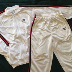 Old-School Adidas Tracksuit Rundmc-Style. Size Woman Small In White With Signature Red/Black Adidas Stripes On Jacket And Pant. Pockets On Jacket And Zip Pockets On Pants. Few Light Stains On Pant Front, Otherwise In Very Good Condition. From Smoke/Pet Free Environment. Always Packed With Care. Thx For Viewing. Sporty Fitted Adidas Sets, Fitted White Adidas Sets, Adidas White Long Sleeve Set, Adidas Tracksuit, Adidas Pants, Light Stain, White Adidas, Black Adidas, Track Pants