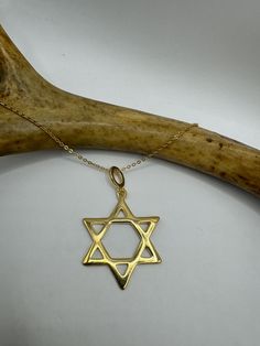 Vintage Star of David, Mogan David, Jewish Star 9k gold filled larger size about an inch  Lovely etched design Matching fine gold filled chain 16, 18, 20 or 22 inches  Thank you for supporting a small veteran owned business. All jewelry is shipped free within the US in a stylish gift box  PLEASE NOTE If we have multiples of the same vintage item, it is because we often purchase factory remnants or odd lots. Likewise, if you have a product to sell, please reach out! Thank you, Tom Gold Sterling Silver Star Of David Necklace, Gold Engraved Star Of David Necklace, Engraved Star-shaped Yellow Gold Necklace, 14k Gold Star Of David Necklace, Tarnish Resistant, 14k Gold Star Of David Necklace Engraved, 14k Yellow Gold Star Of David Necklace, Engraved Star Yellow Gold Necklace, Gold Star Of David Necklace For Anniversary, Hallmarked 14k Gold Star Of David Jewelry