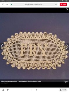 a white doily with the letter t on it