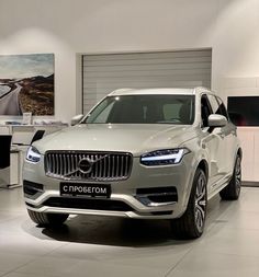 the new volvo suv is on display at an automobile showroom in this photo, it's all white