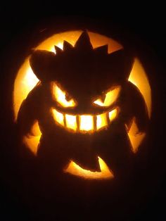 a carved pumpkin with an evil face on it