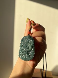 A hand carved blue jadeite Chinese dragon pendant. In the back side, four Chinese signs are carved -  "龙腾四海". The saying of the four Chinese sign "龙腾四海" (Lóng téng sì hǎi) can be translated as "The dragon soars across the four seas." It symbolizes power, strength, and the ability to overcome challenges and achieve greatness, often representing the pursuit of success and prosperity in all directions.  Size of the dragon pendant: 50cm x 36mm x 10mm Knowledge about jade behind the scenes: Wearing " Chinese Signs, Chinese Bracelet, Chinese Heritage, Jade Dragon, Chinese Mythology, Sea Dragon, Dragon Necklace, Dragon Pendant, Chinese Dragon