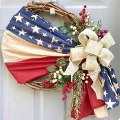 an american flag wreath hanging on the front door