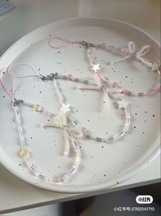 a white plate topped with lots of beads