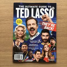 the ultimate guide to ted lasso's they're back magazine on a wooden table