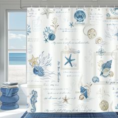 a shower curtain with sea shells and starfish on it