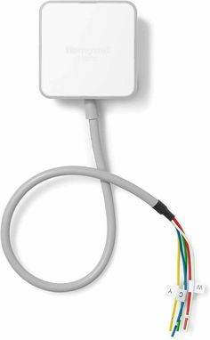 an apple power adapter plugged in to a wall charger with multiple colored wires