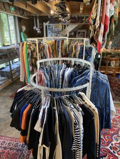 a rack full of clothes in a clothing store