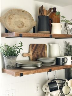 the shelves are filled with dishes and plates