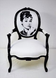 a black and white chair with a picture of a woman on it