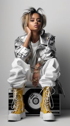 a woman sitting on top of a record with her hands in her pockets and wearing yellow boots