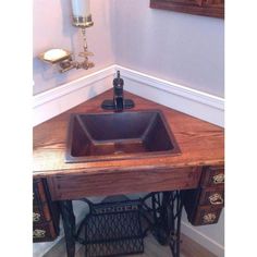 an old sewing machine turned into a sink