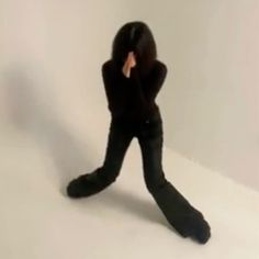 a blurry image of a person in black clothing