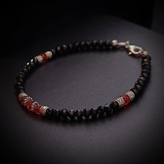 If you are looking for an elegant and original bracelet, this is the one for you. This bracelet is made with black spinel and red quartz, two precious stones that symbolize strength and passion. Black spinel is a protective stone that gives courage and determination. Red Quartz is an inspiring stone that lights the fire of love and creativity. The contrast between black and red creates a captivating and sophisticated visual effect. The bracelet is made of 925 silver and matches perfectly with th Fire Of Love, Red Quartz, Bracelet In Silver, Black Spinel, Quartz Bracelet, The Fire, Precious Stones, Favorite Jewelry, 925 Silver