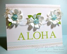 a card with flowers on it that says aloha