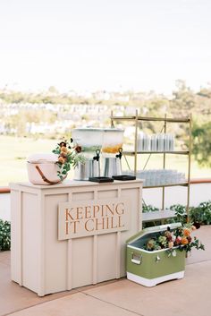 an ice cream stand with flowers on it