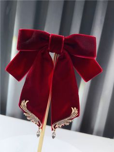 There is a pin on the back of the bow tie.  This price is for a bow tie only, others are not included.   	 		 			Size 			Free Size 		 		 			Length 			13 		 		 			Width 			14 Red Bow With Butterfly Knot For Party, Elegant Red Bow With Butterfly Knot, Elegant Red Bow Tie, Elegant Red Bow Tie As Gift, Formal Hair Accessories With Bow, Elegant Red Bow For Gift, Elegant Formal Hair Accessories With Ribbon, Elegant Evening Hair Accessories With Decorative Bow, Elegant Satin Bow Hair Accessories For Evening