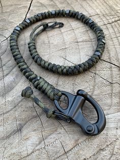 "Dark Camo Retention Lanyard Approximately 23 in total length paired with 10 black Hex nuts beads an S type carabiner and a heavy duty metal snap shackle. Medium Snap Shackle Specs:    A quick release snap shackle in a common 2\" overall length size. Spring loaded, latch will not release until ring is pulled sideways away from the shackle. Latch can be resecured without pulling ring. Approx 1.25\" x 1.875\" closed and not counting the pull ring. Approximate weight is 1.7 ounces. S-Biner Specs: S Leather Edc Lanyard Bead, Paracord Messer Lanyard, Leather Edc Lanyard, Paracord Uses, Paracord Projects Diy, Paracord Accessories, Edc Wallet, Apocalypse Gear, 550 Cord