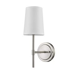 a wall light with a white shade on the side and a metal pole attached to it