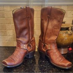 Vintage Mens Texas Boot Company squared toe harness strap western boots. Texas brand harness boots in a nice medium brown. Boots are vintage made in USA. Great patina and worn vintage look. Some scuffing on toes as shown. Minor scuffs and dings from wear. Great classic look.  Made In USA  Size 8D Style M38 36950-1024 Heel to toe 10½" Width 3¾" Heel height 2" Boot height 13½" Around calf 15" Boot Companies, Mens Cowboy, Greensboro Nc, Harness Boots, Cowboy Western, Mens Shoes Boots, Western Cowboy Boots, Medium Brown, Brown Boots