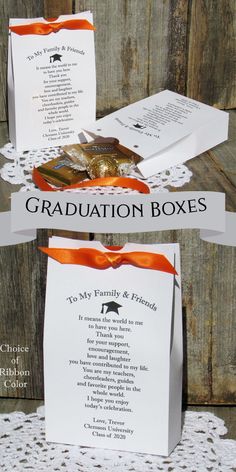 the graduation box is decorated with an orange ribbon