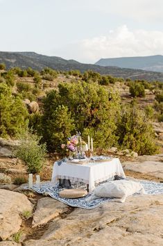 a table set up on top of a rock