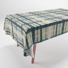 an image of a table with a blue and white checkered cloth on it's top