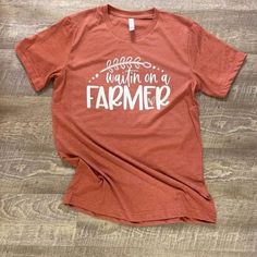 Waitin On A Farmer Tshirt I Know Theres A Bunch Of You Ladies Out There That Are Always Waiting On Your Farmer. - You Need This Tee. Its A Heather Clay Bella Canvas Unisex T-Shirt - Very Soft And Comfortable. 52 Cotton/48 Poly Farm Tshirt, Mom Graphic Tees, A Farmer, Fall Tee, Bachelorette Shirts, Bella Canvas Tees, Need This, Farmer, Bella Canvas