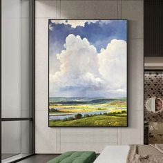 a bedroom with a large painting hanging on the wall