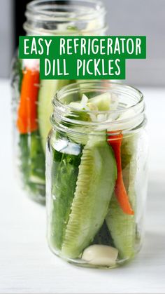 three mason jars filled with pickles and carrots