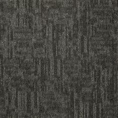 a black and white textured carpet with vertical lines in the middle, as well as small dots