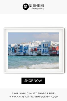 a white frame with the words shop now on it and an image of colorful houses in the background