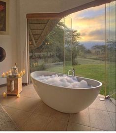 a large bath tub sitting inside of a bathroom