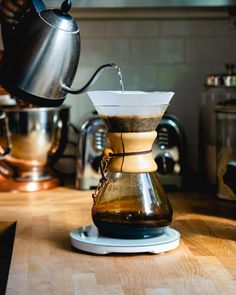 a coffee pot is being filled with liquid