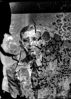 a black and white photo of a man in front of a mirror with hearts on it