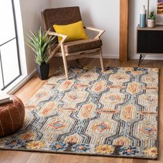 a living room with a chair and rug