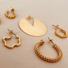 Welcome to AVINZIA, here you'll discover a stunning collection of affordable, tarnish-free gold jewelry featuring exclusive designs. Click on this link to explore our shop: https://www.etsy.com/shop/AVINZIA We pride ourselves on our quick response time, so don't hesitate to reach out with any questions! Please note that all sales are final. However, we offer store credit and exchanges within 14 days of delivery. Processing for exchanges takes 3-5 business days after delivery, and we reserve the right to refuse returns that don't meet our criteria. We also sell charms separately if you prefer! Not sure about the size? Reach out to us before placing your order, and we'll provide all the details you need. If you're looking for a custom item or your favorite product is out of stock, get in tou Minimalist Gold-plated Hoop Earrings, Minimalist Plated Metal Hoop Earrings, Everyday Gold Hoop Earrings With Plating, Trendy Gold-tone Hoop Earrings Gift, Trendy Round Hoop Earrings With Plating, Trendy Gold-tone Jewelry With Matching Earrings, Trendy Gold Single Earring Jewelry, Trendy Round Hoop Earrings, Trendy Gold Single Earring