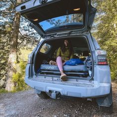 a person sitting in the back of a van