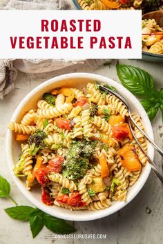 a white bowl filled with pasta and vegetables next to a plate of broccoli