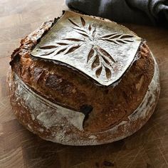 a loaf of bread sitting on top of a wooden table