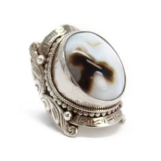 "Wozer! This is a RING! A beautiful brown and white banded agate hand bezel set in a huge, ornate sterling silver setting! This ring definitely makes a statement. Size 10 US - can not be resized Stamped 925 inside band Face of the ring is 1.47\" L (37.4mm) x .94\" W (24mm) Band tapers to 6mm at the back 30.6 g - substantial weight Vintage I found this ring in an estate sale. It is a used item. It does show some signs of wear consistent with its age. Please inspect photos closely. It is working a Silver Gift Wrap, Statement Ring Silver, Real Vintage, Banded Agate, Silver Gifts, Statement Ring, Rings Statement, Estate Sale, Beautiful Earrings