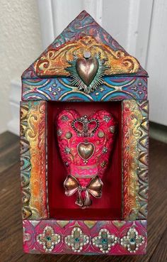 an ornate box with a heart in it