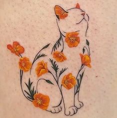 a white cat with orange flowers on it's chest